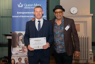 A ReMAKE graduate receiving their certificate at Queen Mary University of London